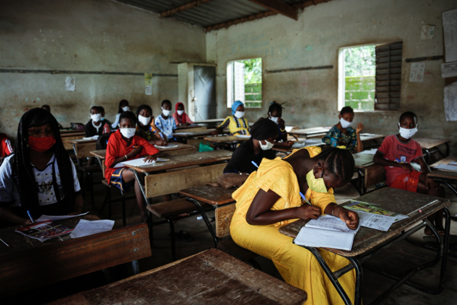 Young girls take a pre-entrance exam for junior high school (collège)